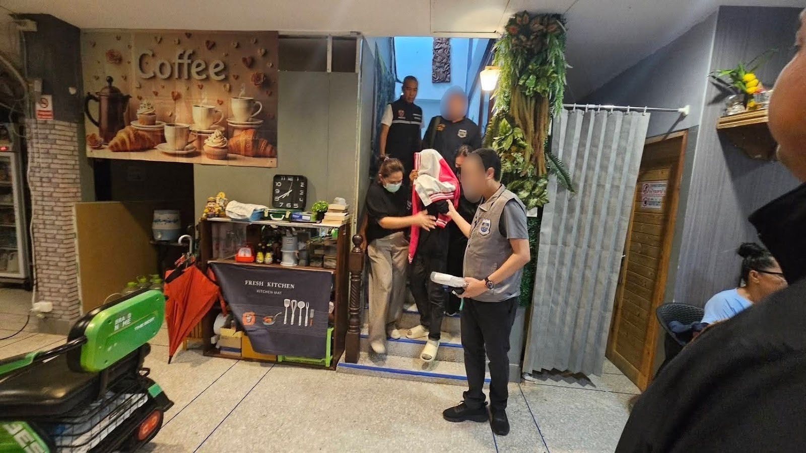 Talay being escorted to safety by caseworkers